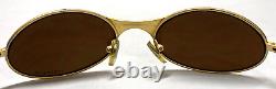Vintage OAKLEY T-WIRE 1.0 Gold Metal Titanium Wrap Sunglasses Rare